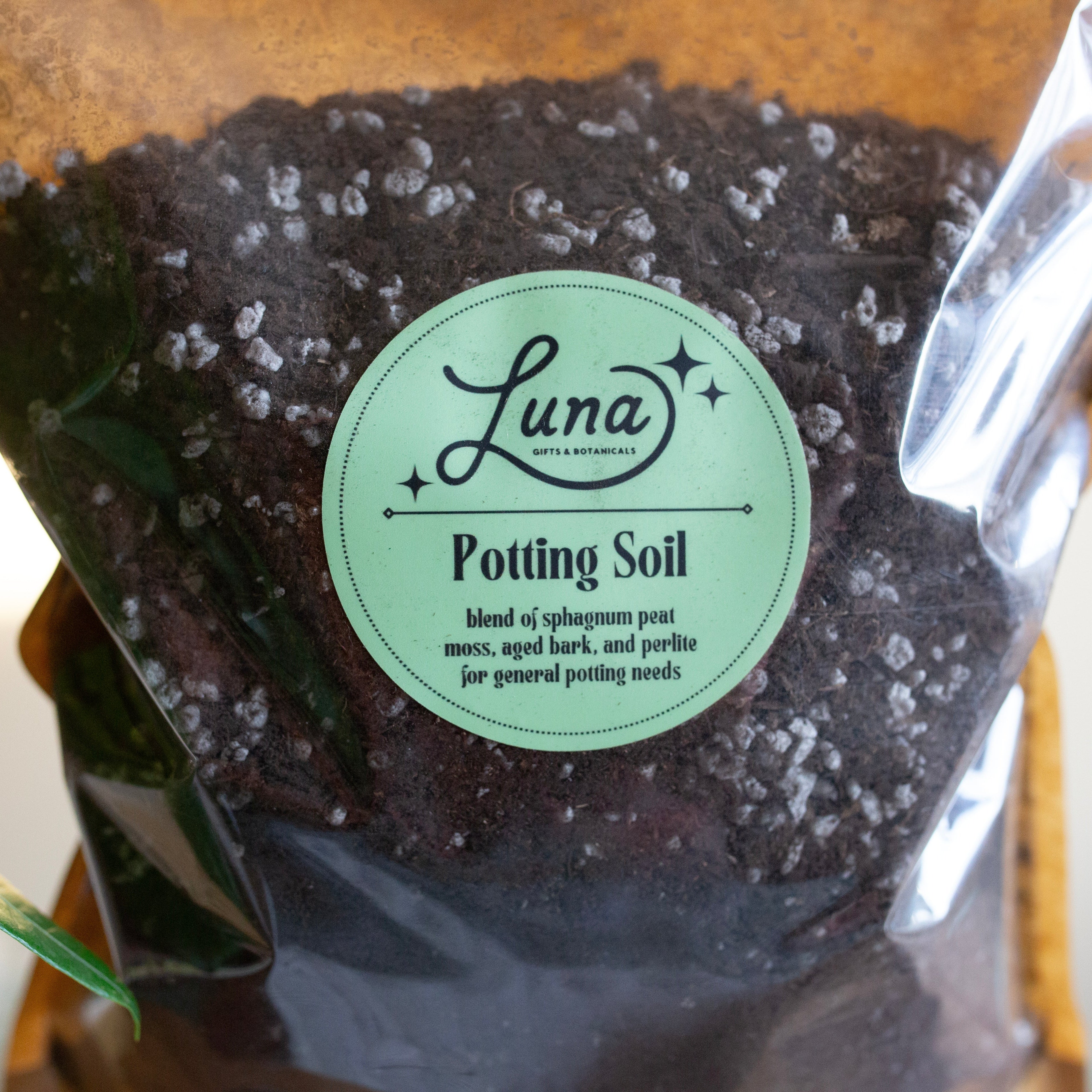 Bag of Luna Potting Soil with a visible brand label, ingredients listed in description