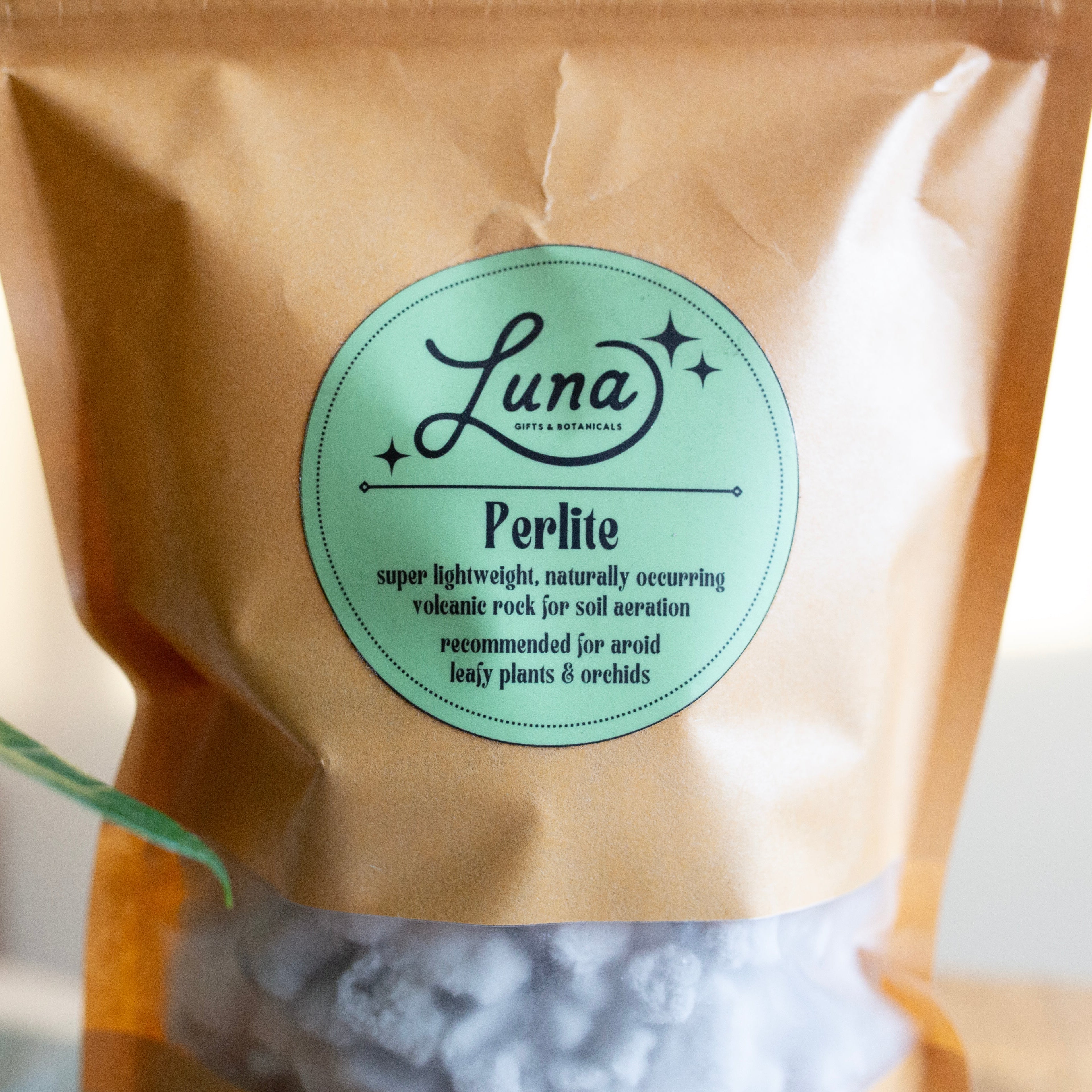Bag of Luna Perlite with a label on a neutral background