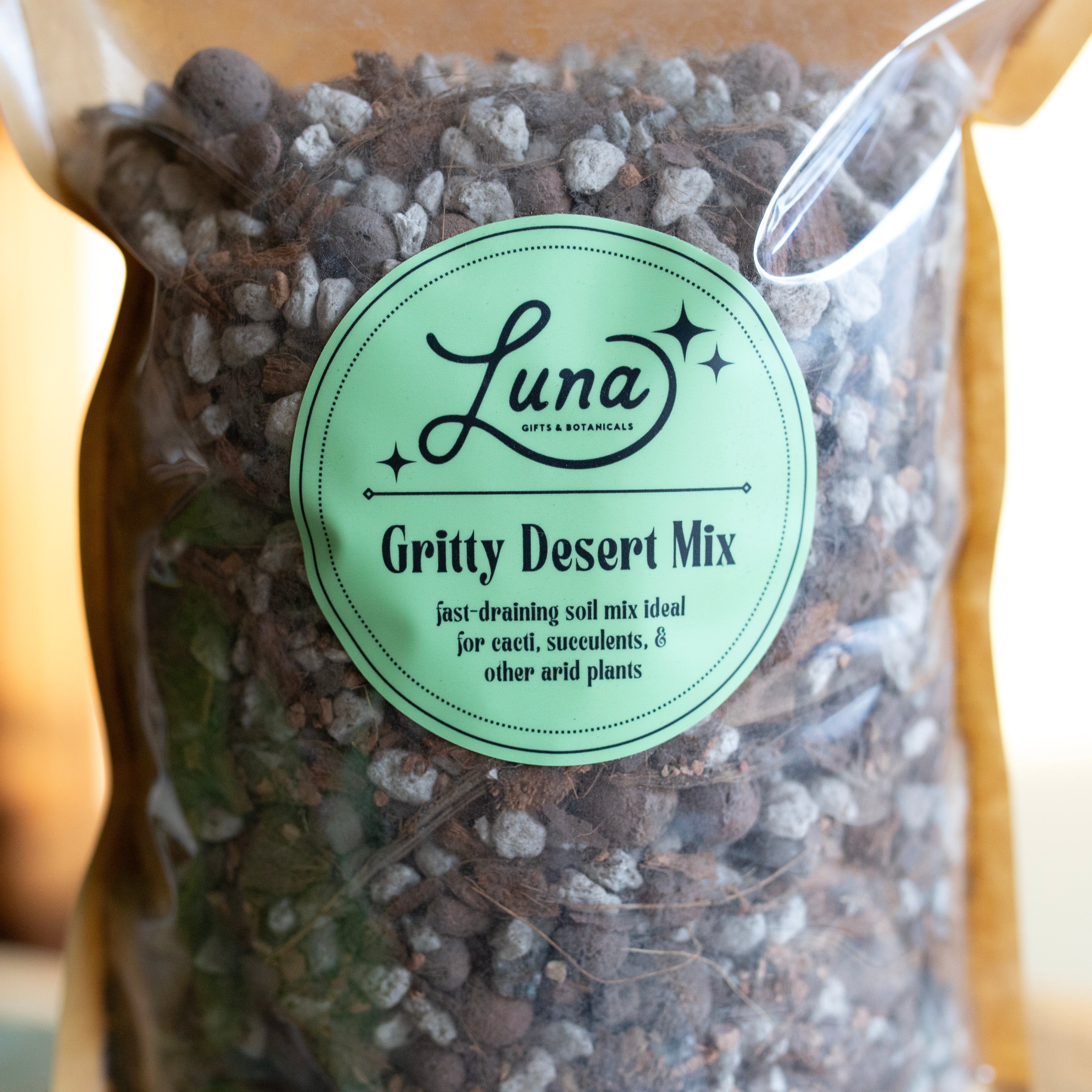 Close up picture of bag of Luna Gritty Desert Mix with a label on a blurred background, label description is located in product's description